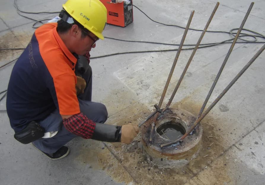 Reinforcement anchorage prepared at a precast pile head before pile-cap construction
